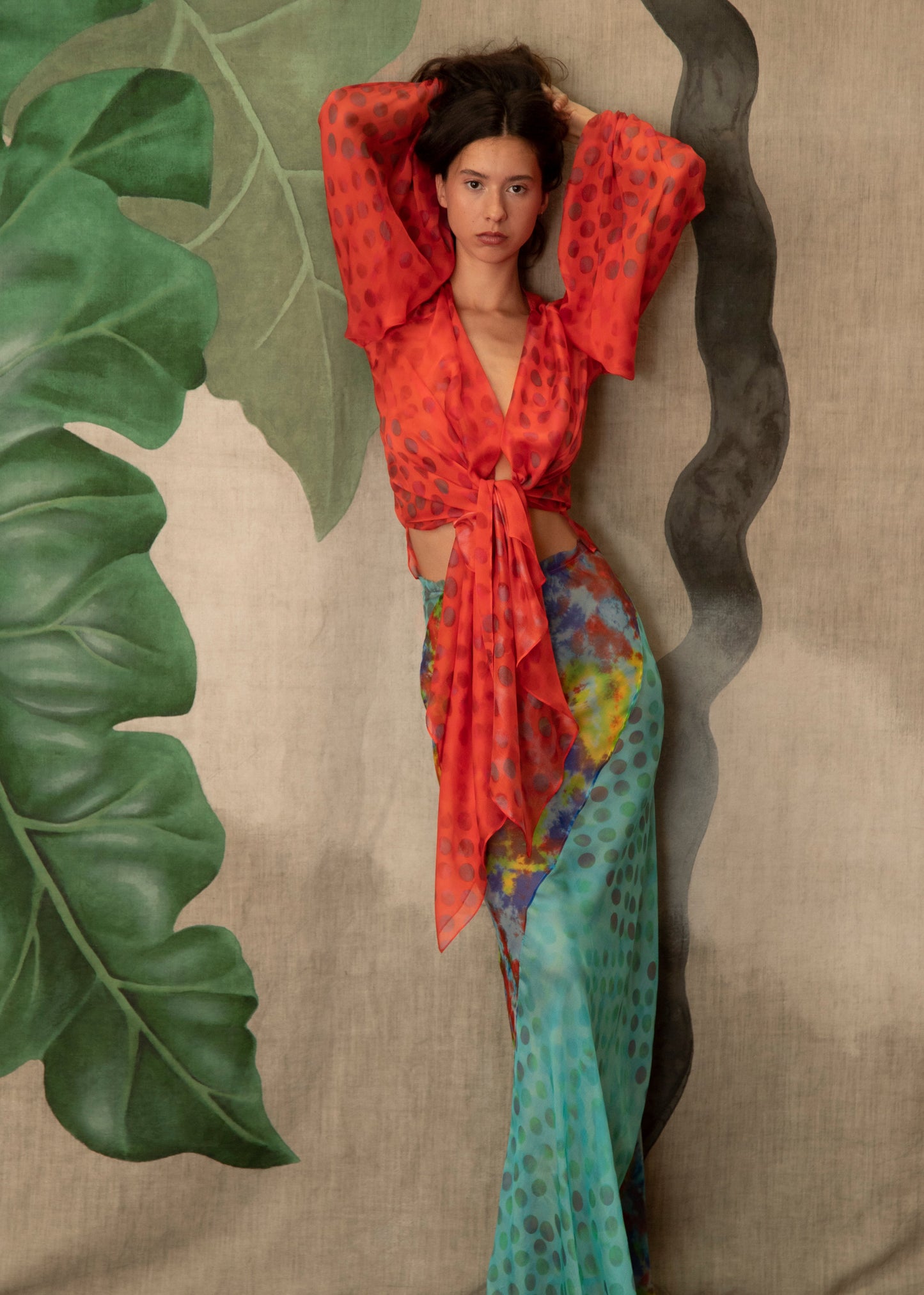 Woman wearing Exotica skirt in daydream on a textured background