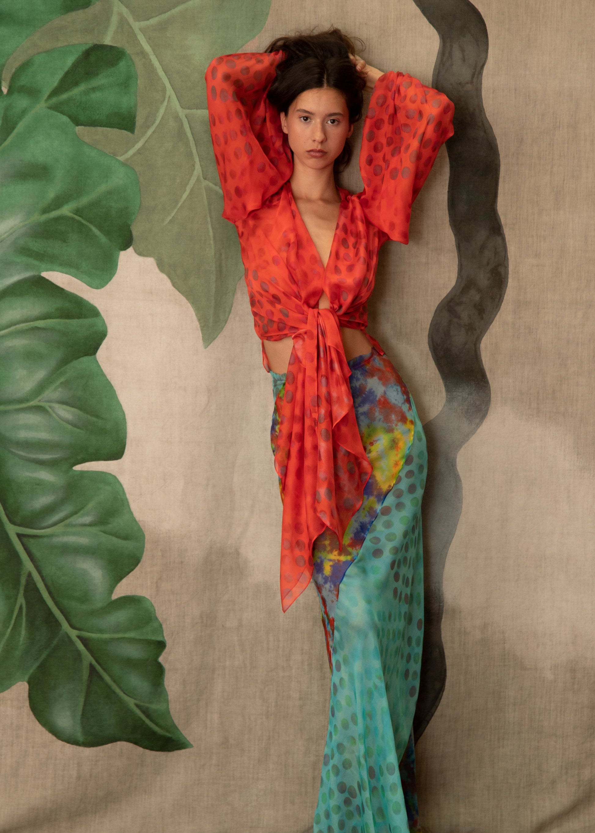 Woman wearing Exotica skirt in daydream on a textured background