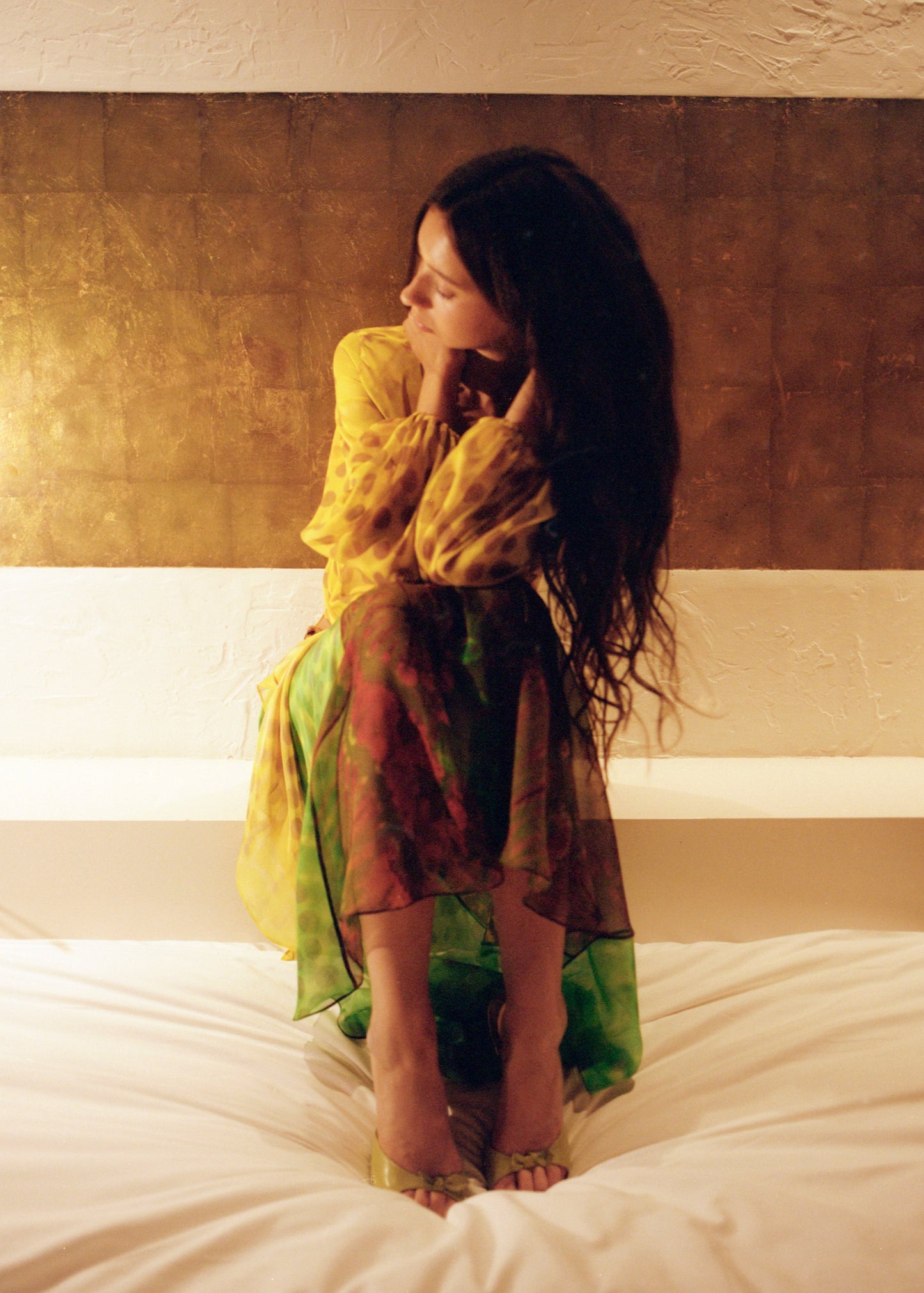 Woman wearing Exotica skirt in nimphidia on bed.